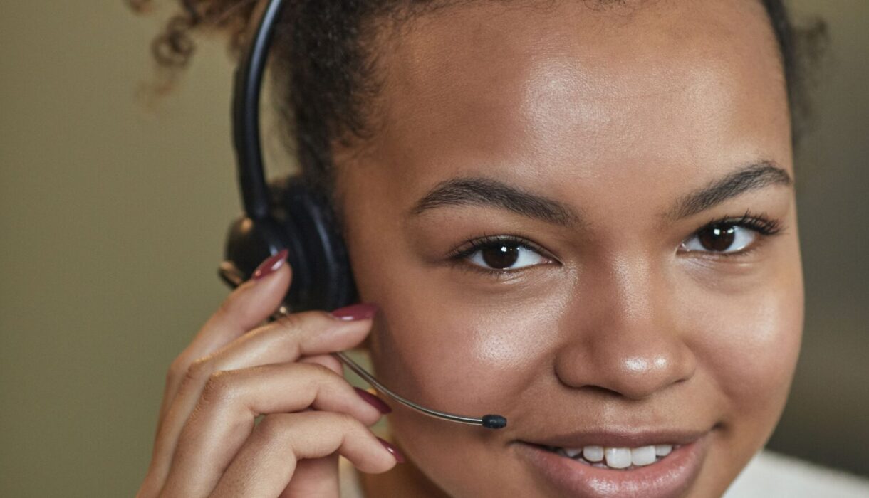 Smiling customer service representative wearing a headset
