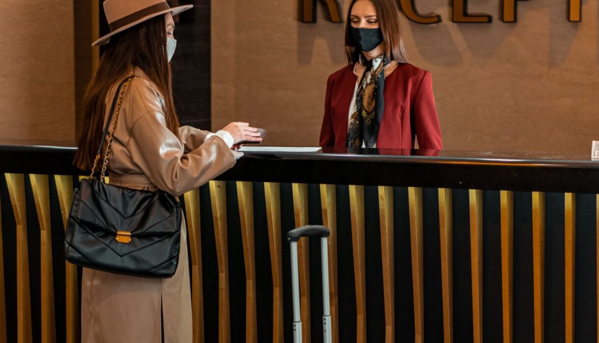 Guest checking in at a hotel reception desk