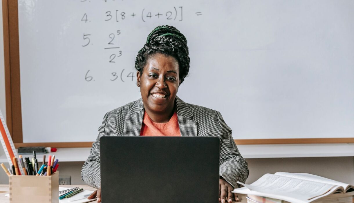 Smiling woman learning on a laptop
