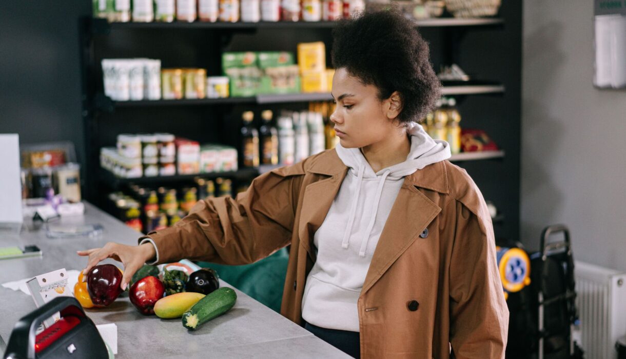 African American woman browsing products inside a grocery store