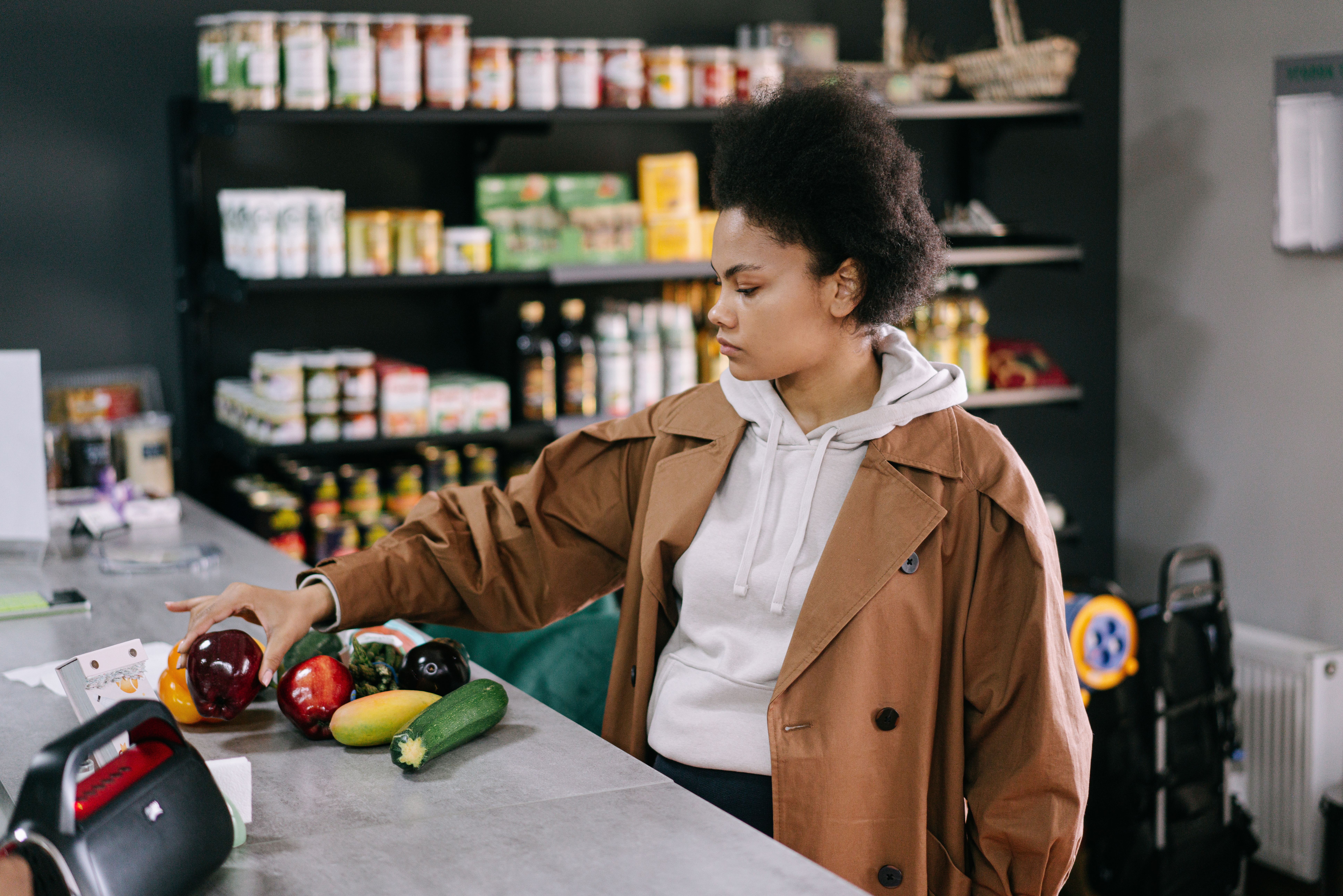 African American woman browsing products inside a grocery store